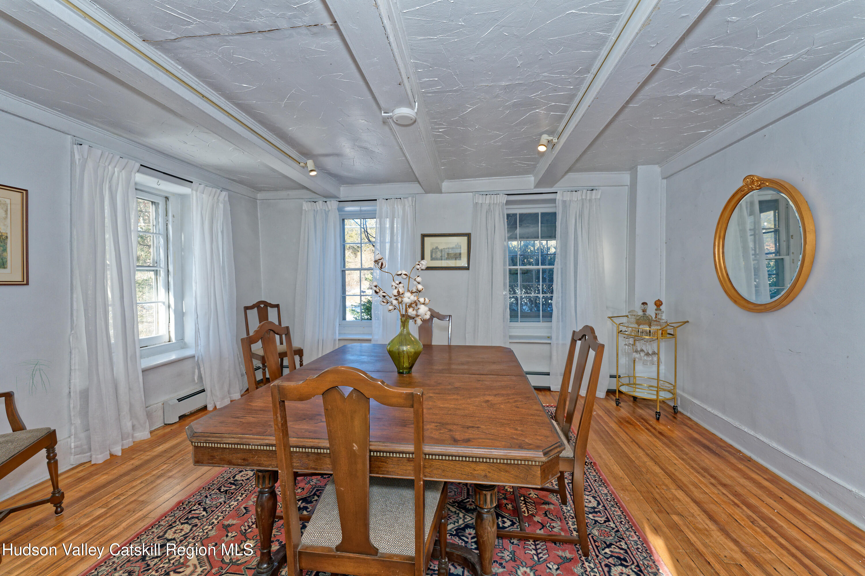 3953-3955 Highway 209 Stone Ridge, NY 12484 - Photo 7 of 69 a view of a dining room with furniture a rug and wooden floor