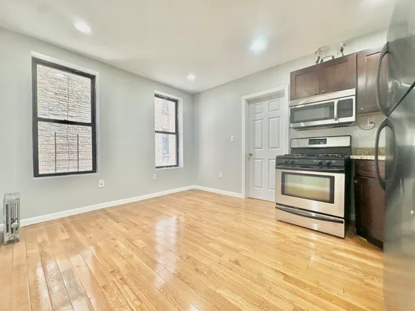 a kitchen with granite countertop stainless steel appliances and counter space