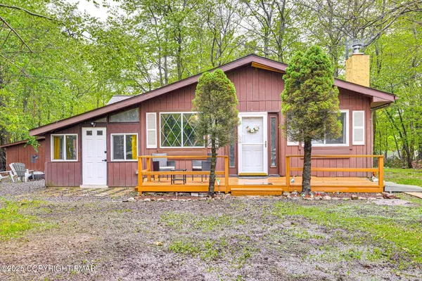 a house with trees in front of it
