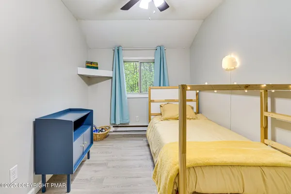 a bed room with a bed and a night stand