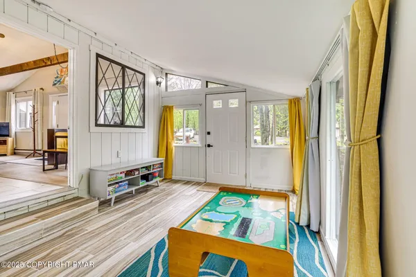 a room with window and glass door