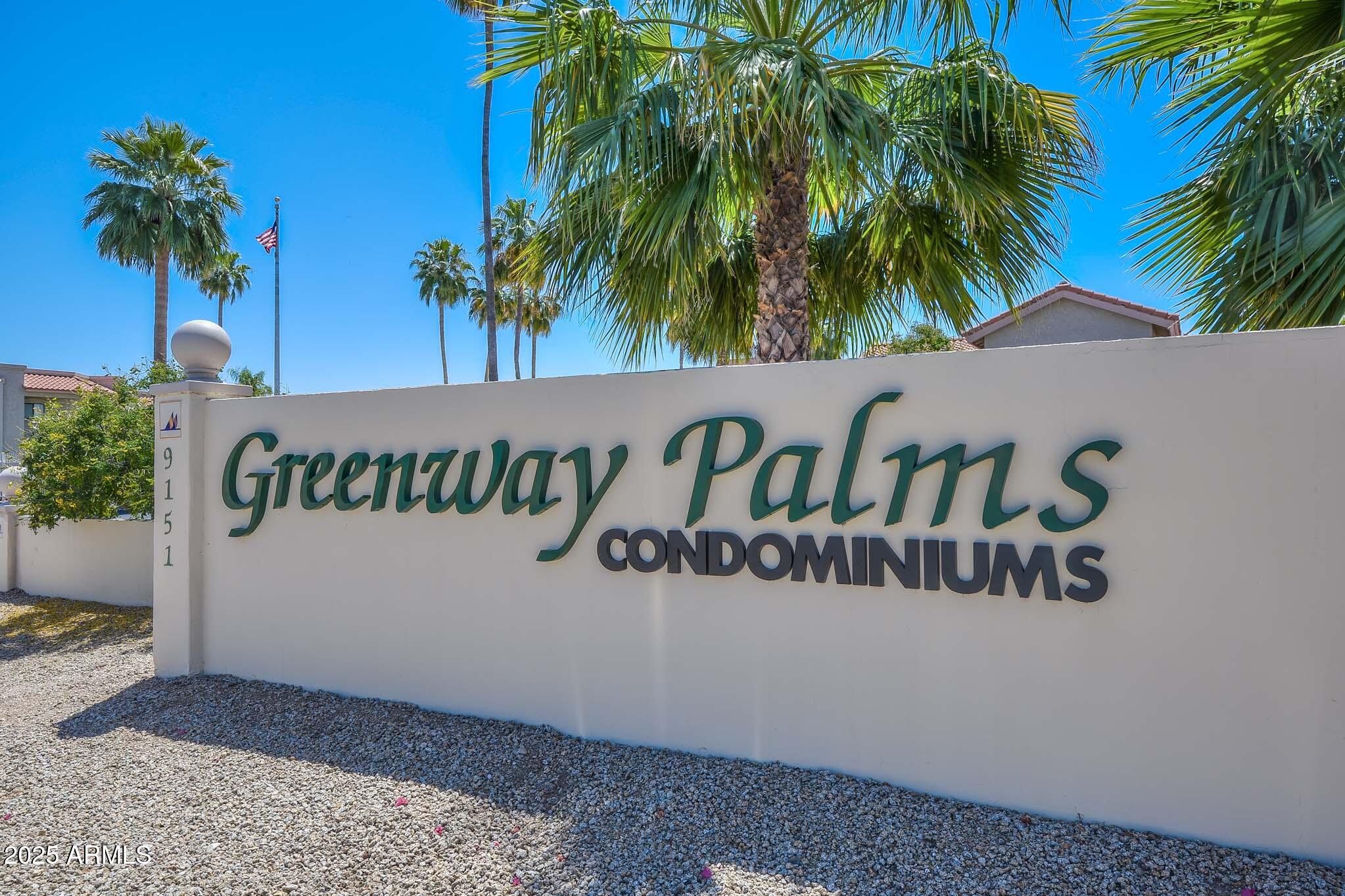 9151 West Greenway Road, Unit 113 Peoria, AZ 85381 - Photo 31 of 36 a street sign that is sitting in front of a house