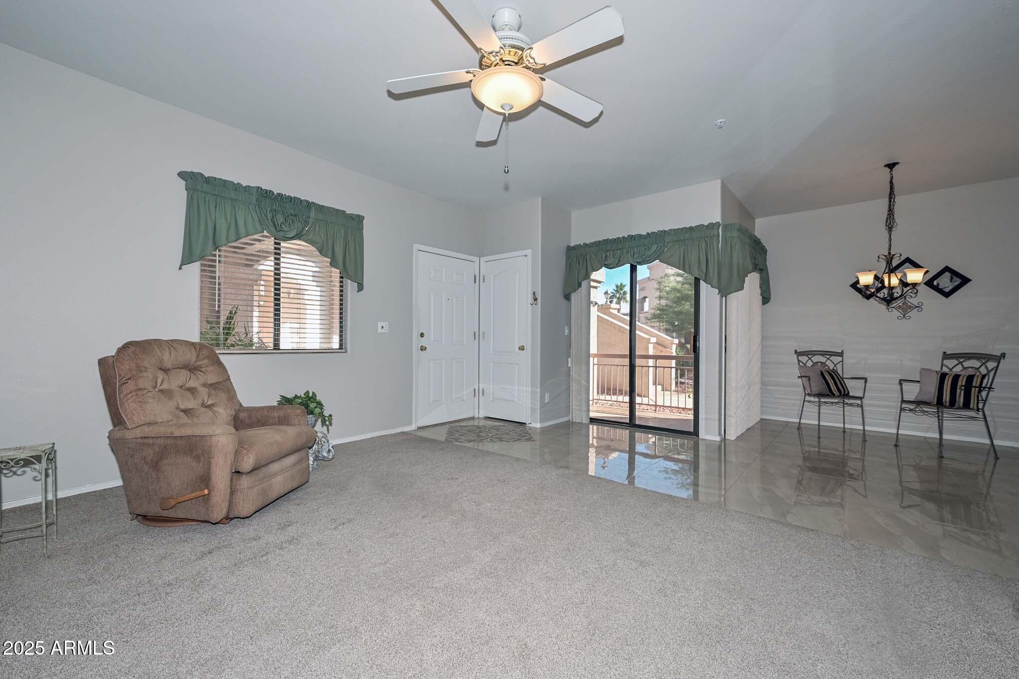 9151 West Greenway Road, Unit 113 Peoria, AZ 85381 - Photo 6 of 36 a view of an empty room with a window