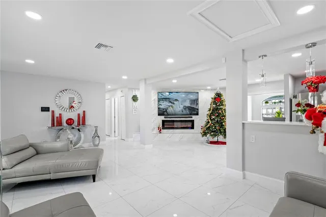 a kitchen with stainless steel appliances granite countertop a refrigerator sink and cabinets