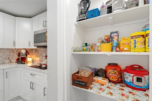 a bedroom with two beds and a window