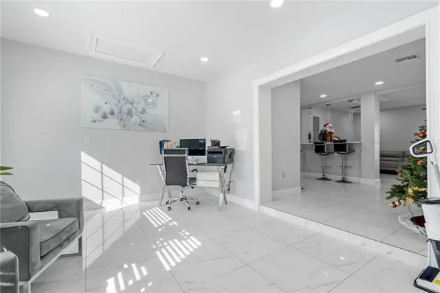 a bedroom with a bed and a tv