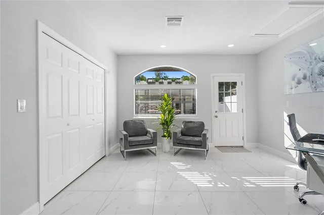 a bath room with a toilet and a shower curtain