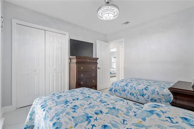 a kitchen view with microwave a refrigerator and wooden floor