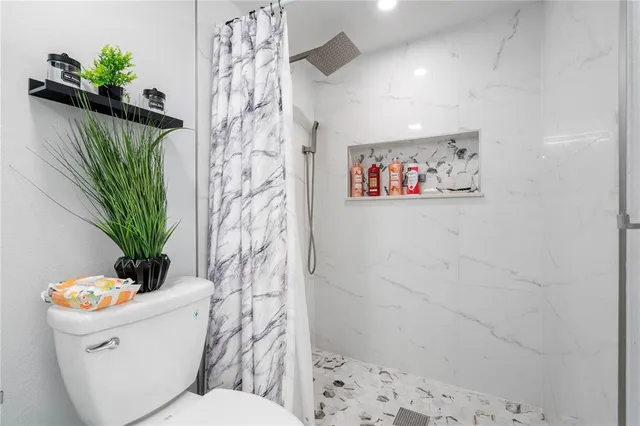 a bathroom with a sink mirror and vanity