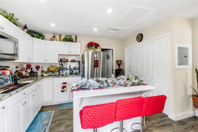 a room with trees and a wooden bench