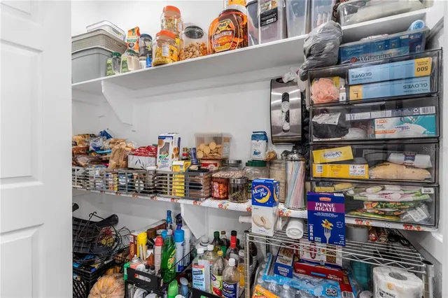 a view of a green field with trees