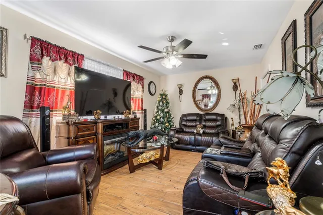 an aerial view of residential house with outdoor space and trees all around