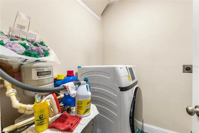 an aerial view of a house with garden space and street view