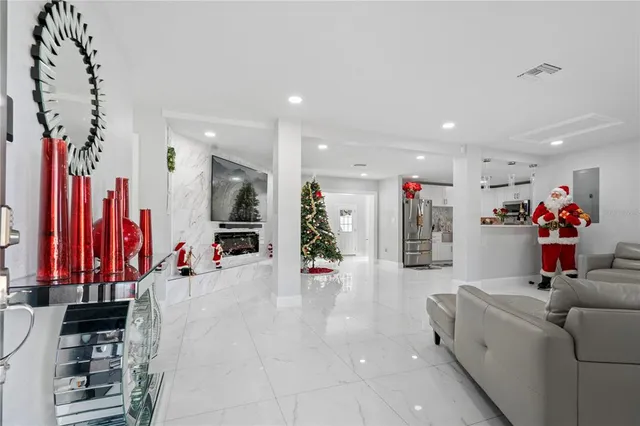 a view of a livingroom with furniture and a flat screen tv