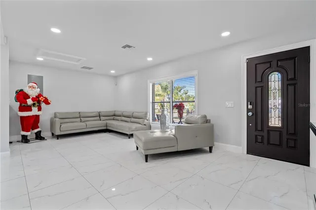 a kitchen with refrigerator and cabinets