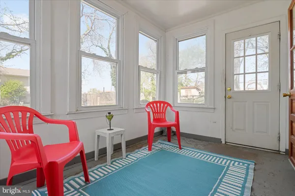 a living room with furniture and windows