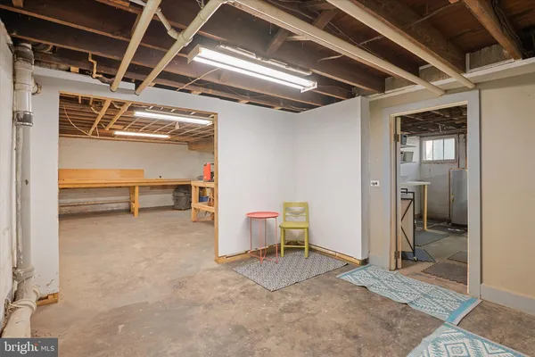 a view of a room with wooden floor and windows