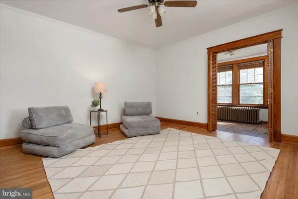a living room with furniture and stairs