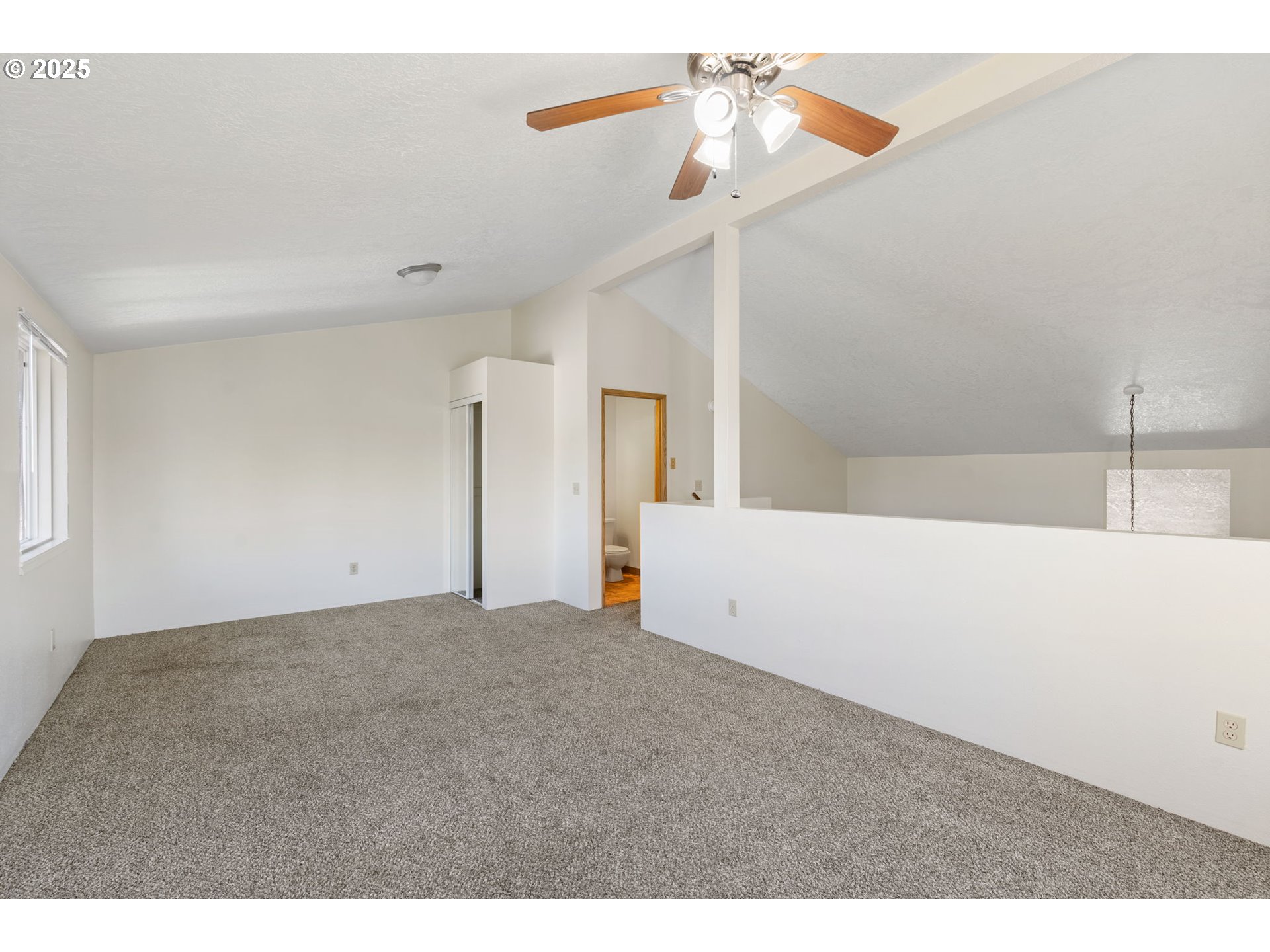 1230 Northwest 23rd Street Corvallis, OR 97330 - Photo 12 of 17 a view of a big room with closet and chandelier fan