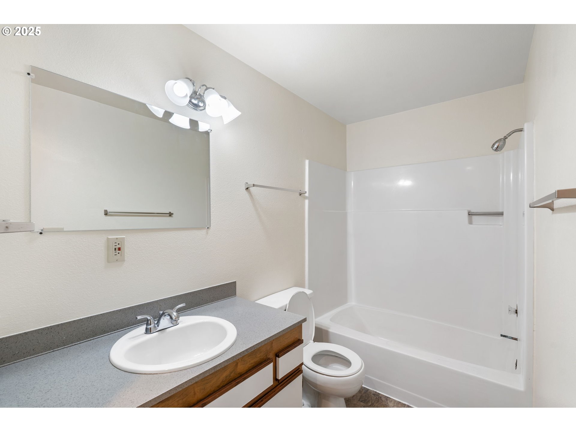 1230 Northwest 23rd Street Corvallis, OR 97330 - Photo 10 of 17 a bathroom with a sink a toilet a mirror and shower