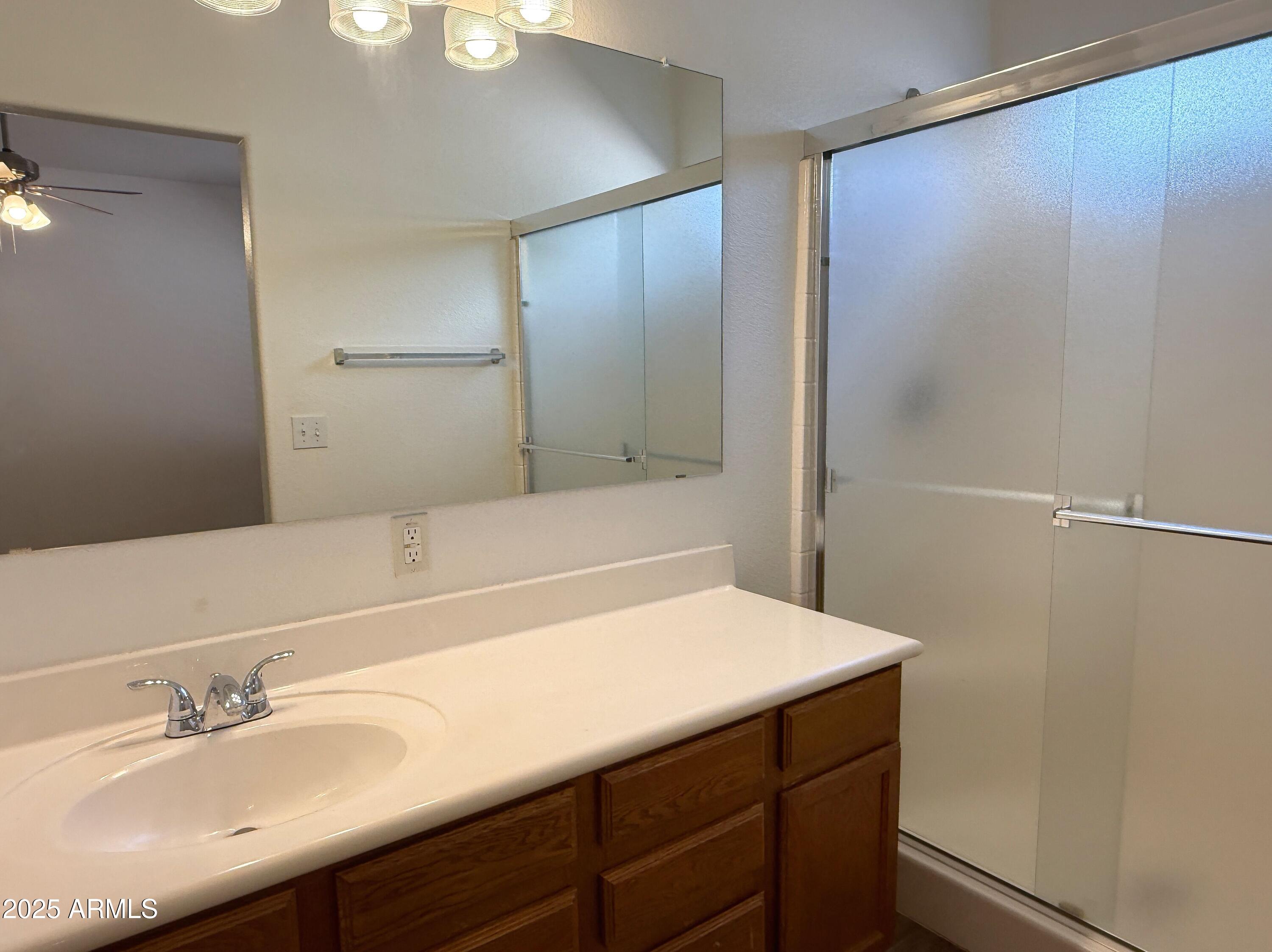2697 East Waterview Court Chandler, AZ 85249 - Photo 12 of 25 a bathroom with a sink and a mirror
