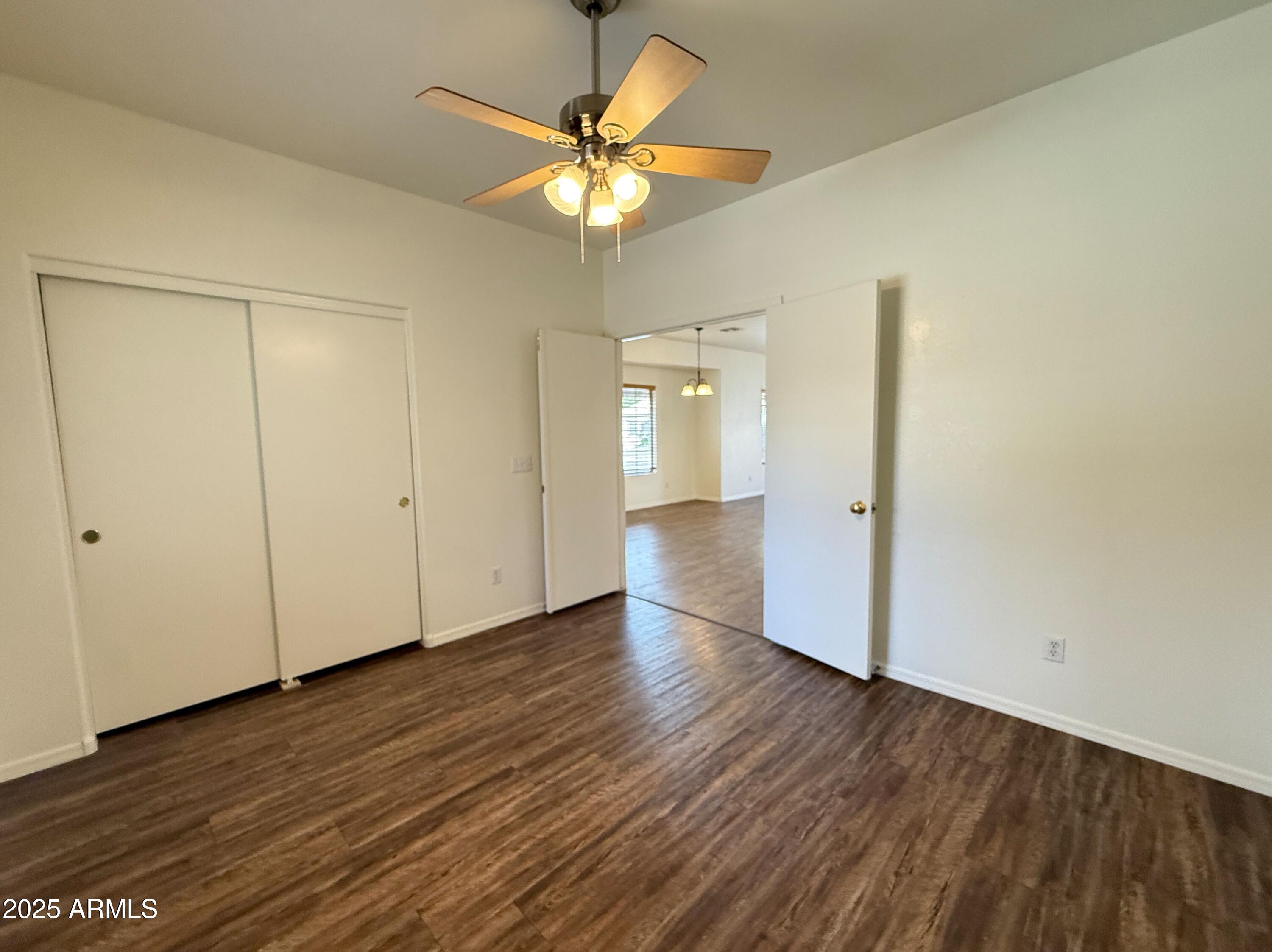 2697 East Waterview Court Chandler, AZ 85249 - Photo 20 of 25 a view of an empty room with wooden floor