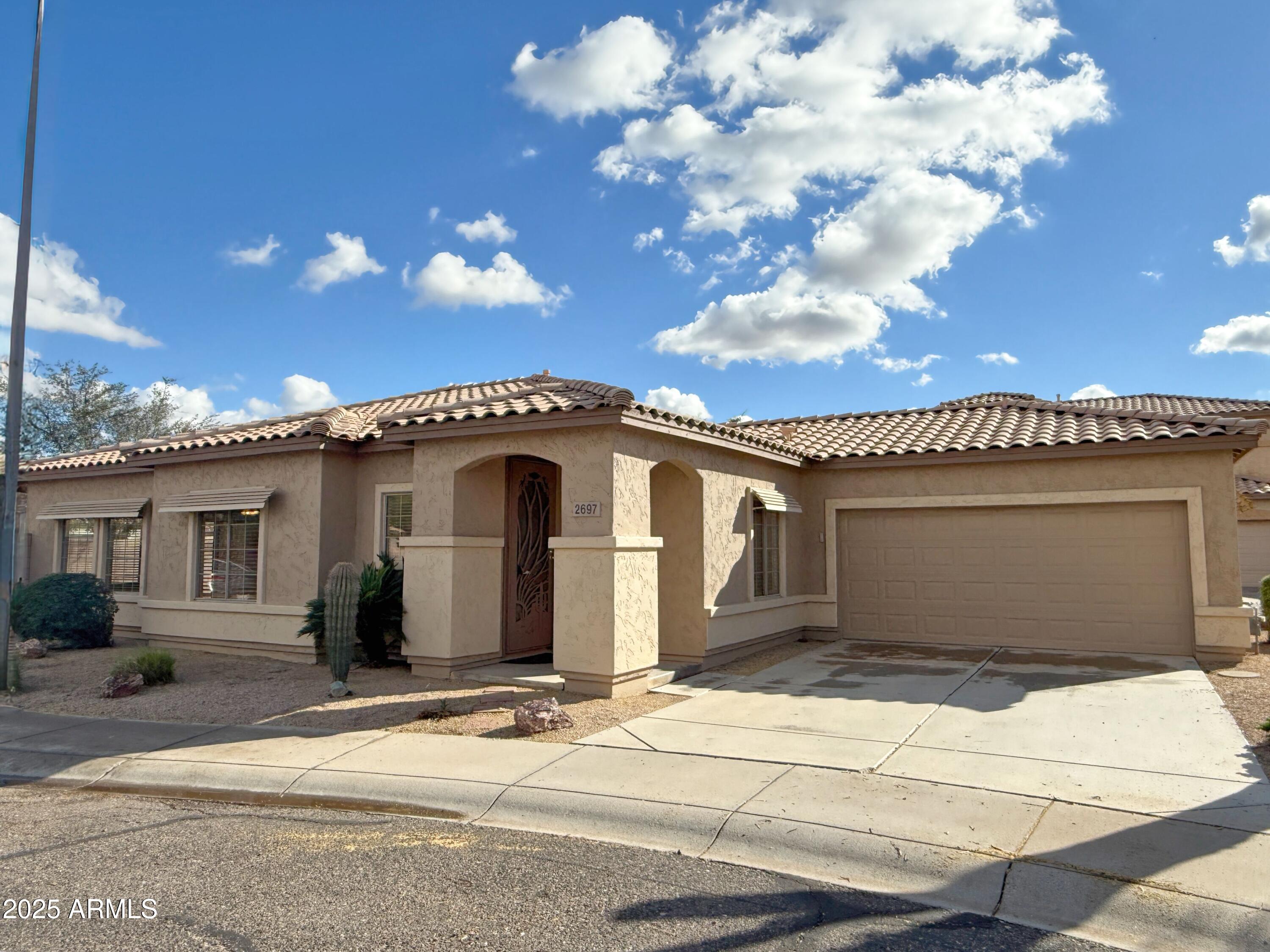2697 East Waterview Court Chandler, AZ 85249 - Photo 2 of 25 a view of a house with a garage