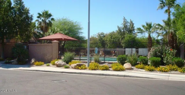 a view of a house with a yard and sitting area