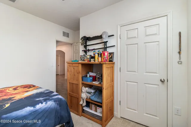 a bathroom with a granite countertop sink a toilet and a bathtub