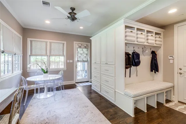 a en suite bathroom with a double vanity sink and a mirror