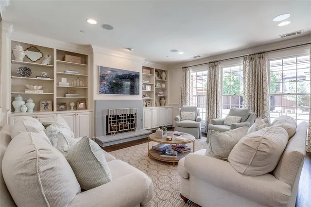 a dining hall with stainless steel appliances granite countertop a sink a dining table and chairs with wooden floor