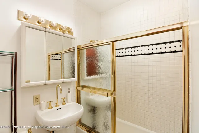 a bathroom with a sink and mirror