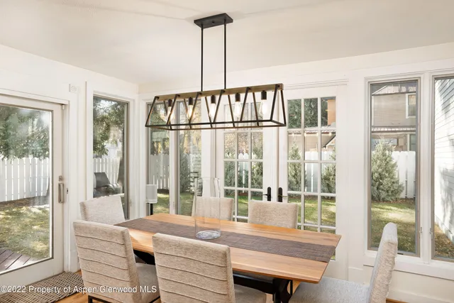 a room with a large window and a bed