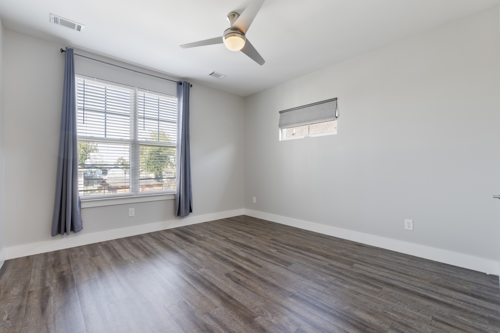 1734 Pecan Street Nashville, TN 37208 - Photo 9 of 17 an empty room with wooden floor and windows