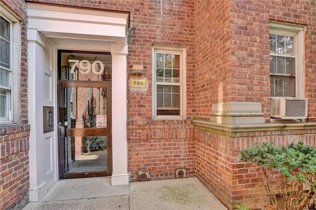 a view of a brick house with windows