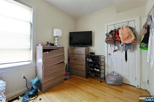 a room with furniture and a flat screen tv