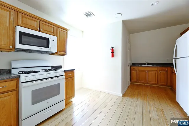 a kitchen with a stove and a microwave