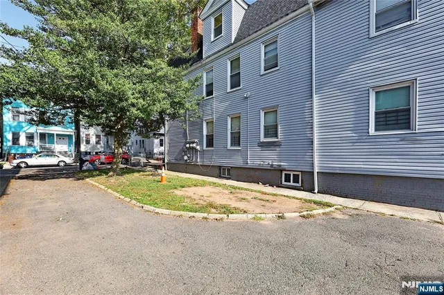 a swimming pool with outdoor seating and yard