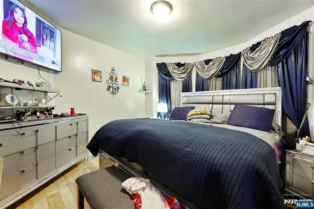 a bedroom with a bed and cabinets