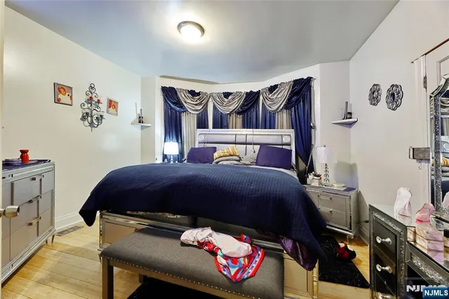 a bedroom with a bed and a closet