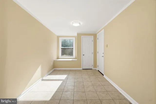 a view of an empty room and window