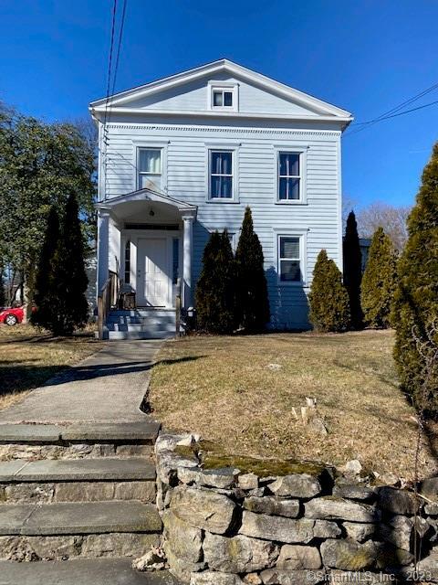 567 Post Road Darien, CT 06820 - Photo 13 of 14 a front view of a house with a yard