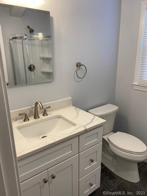 567 Post Road Darien, CT 06820 - Photo 14 of 14 a bathroom with a sink and a toilet