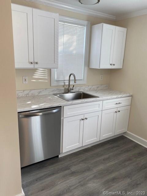 567 Post Road Darien, CT 06820 - Photo 8 of 14 a kitchen with stainless steel appliances granite countertop a sink a stove and white cabinets with wooden floor