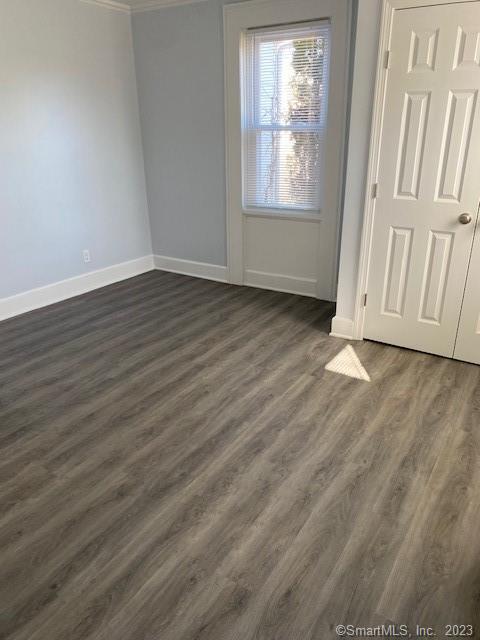 567 Post Road Darien, CT 06820 - Photo 9 of 14 an empty room with wooden floor and windows