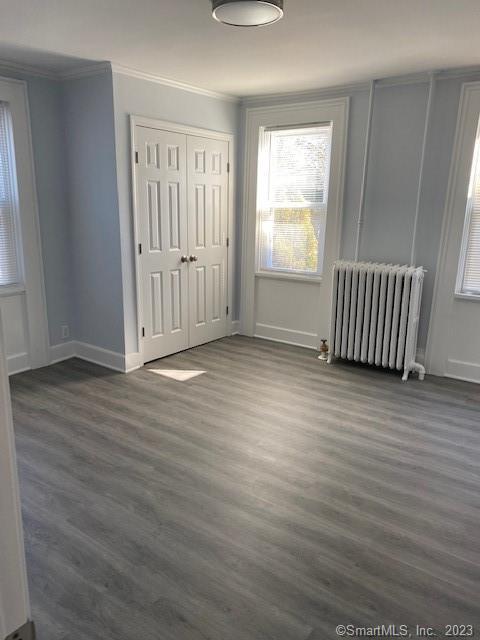 567 Post Road Darien, CT 06820 - Photo 10 of 14 an empty room with wooden floor and windows