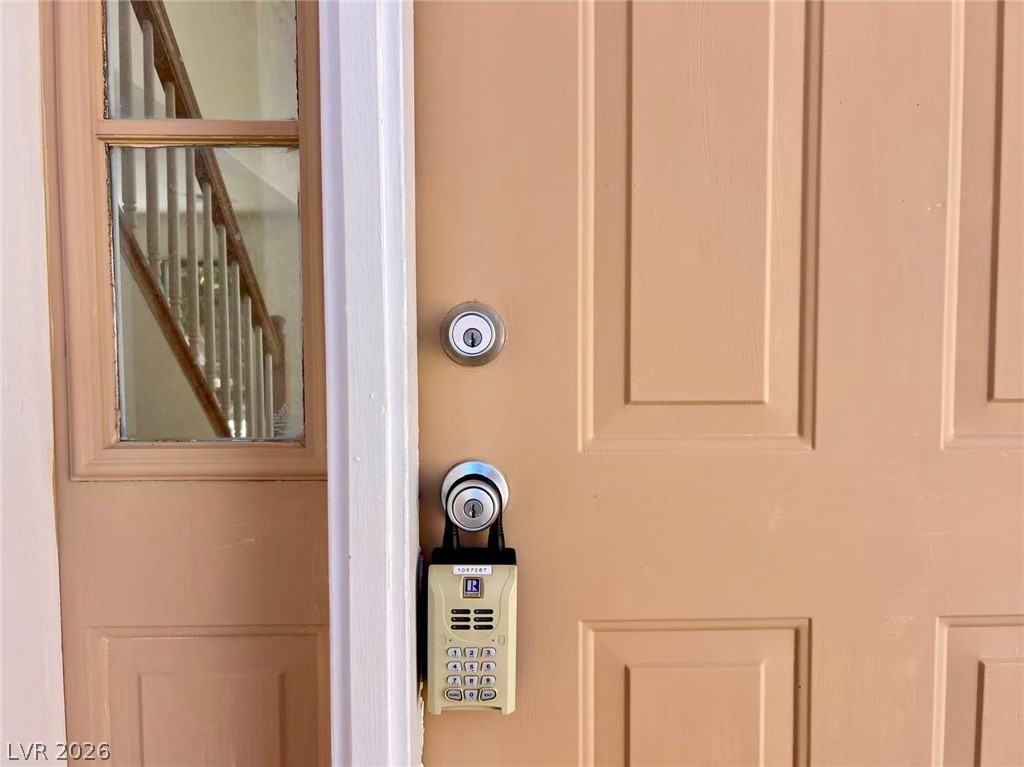 8284 West Rochelle Avenue Las Vegas, NV 89147 - Photo 27 of 29 Secure entry provides peace of mind with a robust main door and smart lock system.