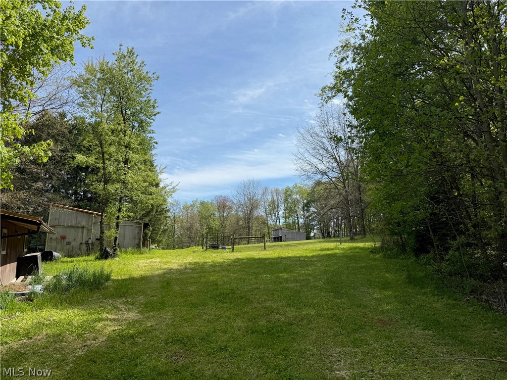 11811 Gaston Road Rogers, OH 44455 - Photo 15 of 38 You've got several acres of usable space, pole barns, and a Quonset Hut (currently used for recreation). Take advantage of the room to play, and play!!