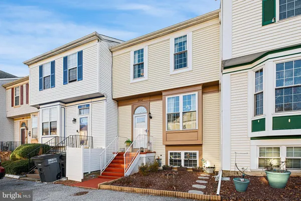 a front view of a house with many windows