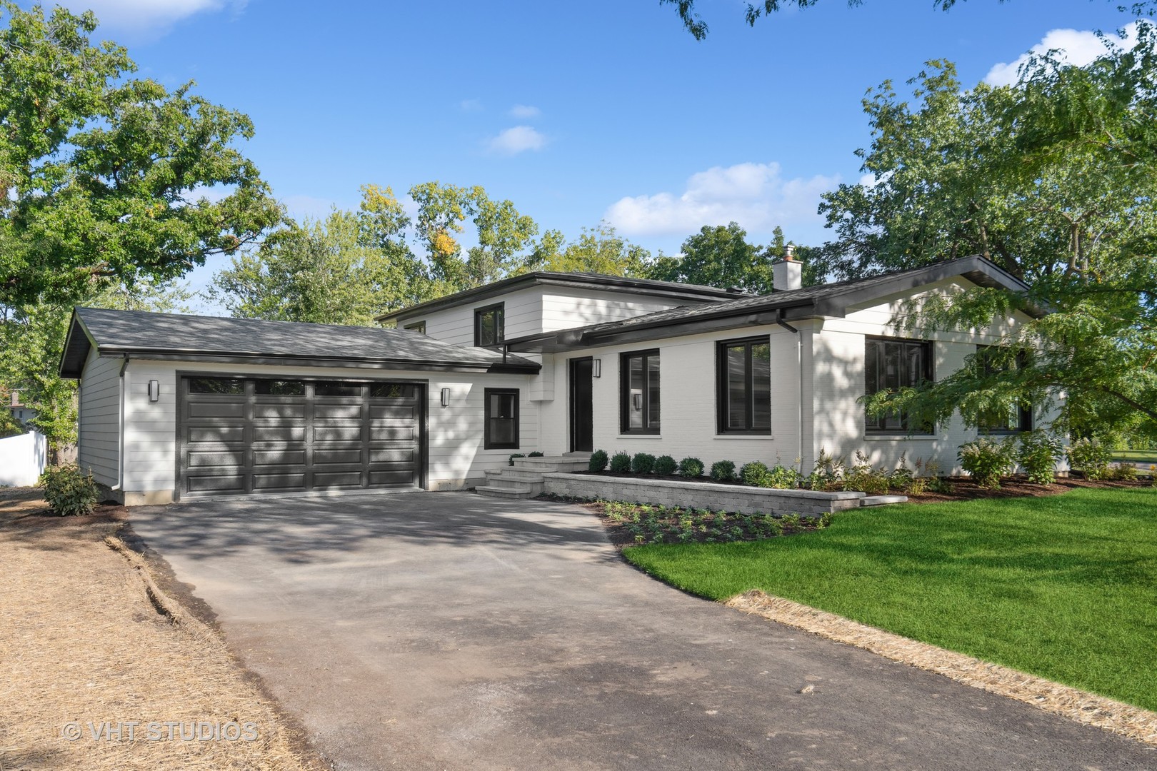 695 Ridge Road Highland Park, IL 60035 - Photo 1 of 23 a front view of a house with a yard